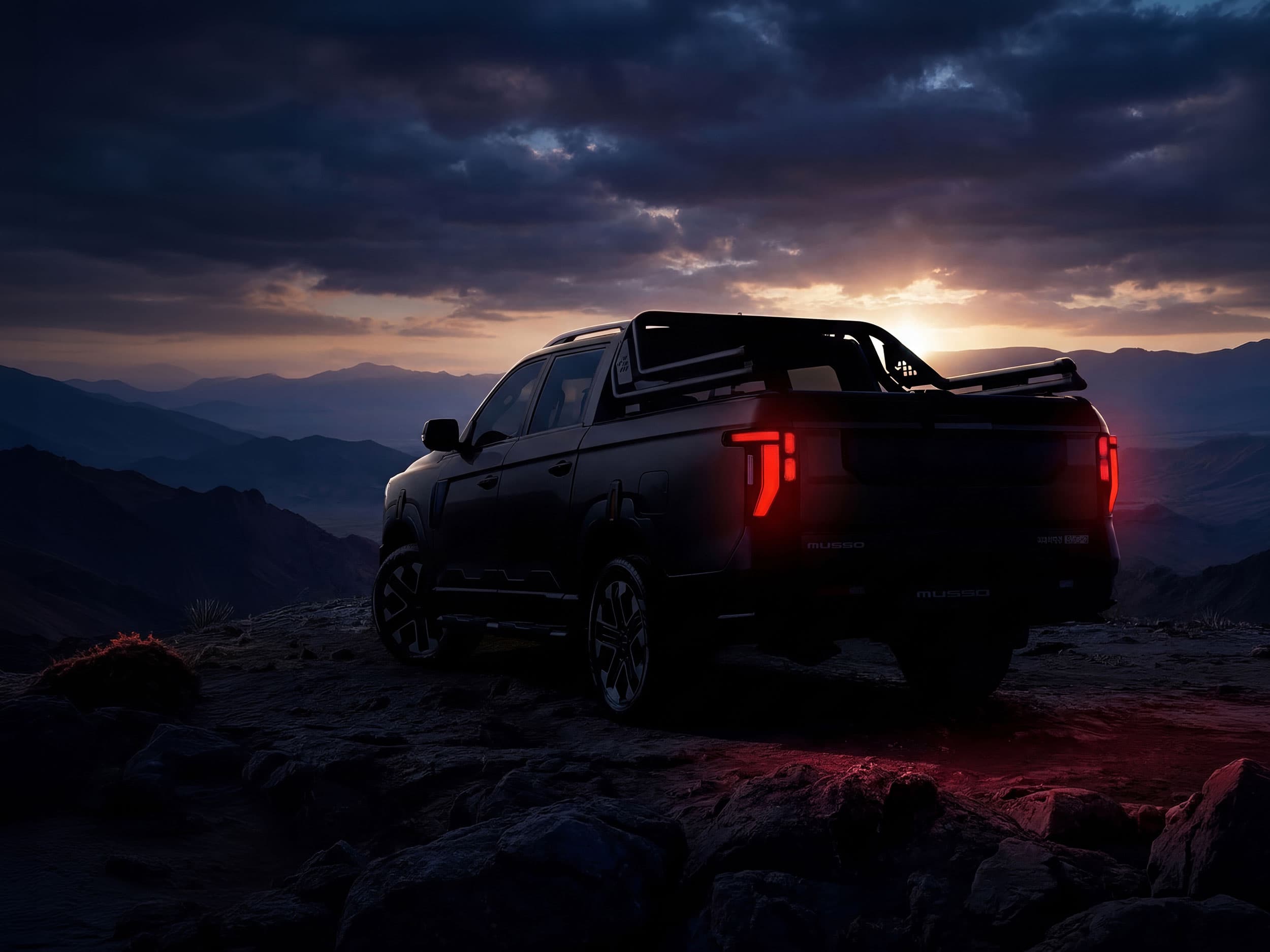 A dark Musso parked on a rocky hilltop at dusk, with its red taillights glowing against a dramatic, cloudy sunset sky.